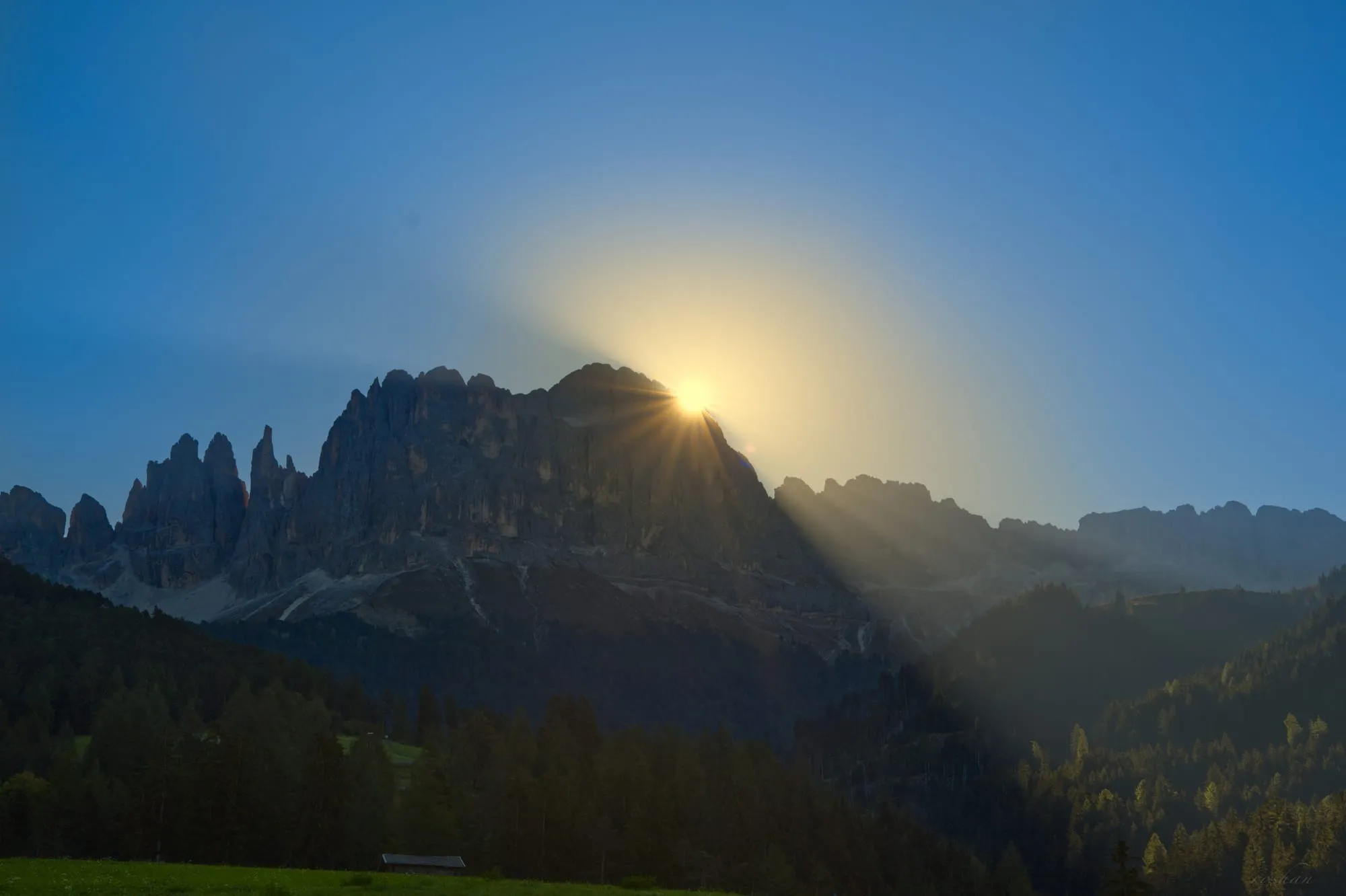 Rocky cliffs and sunrays.